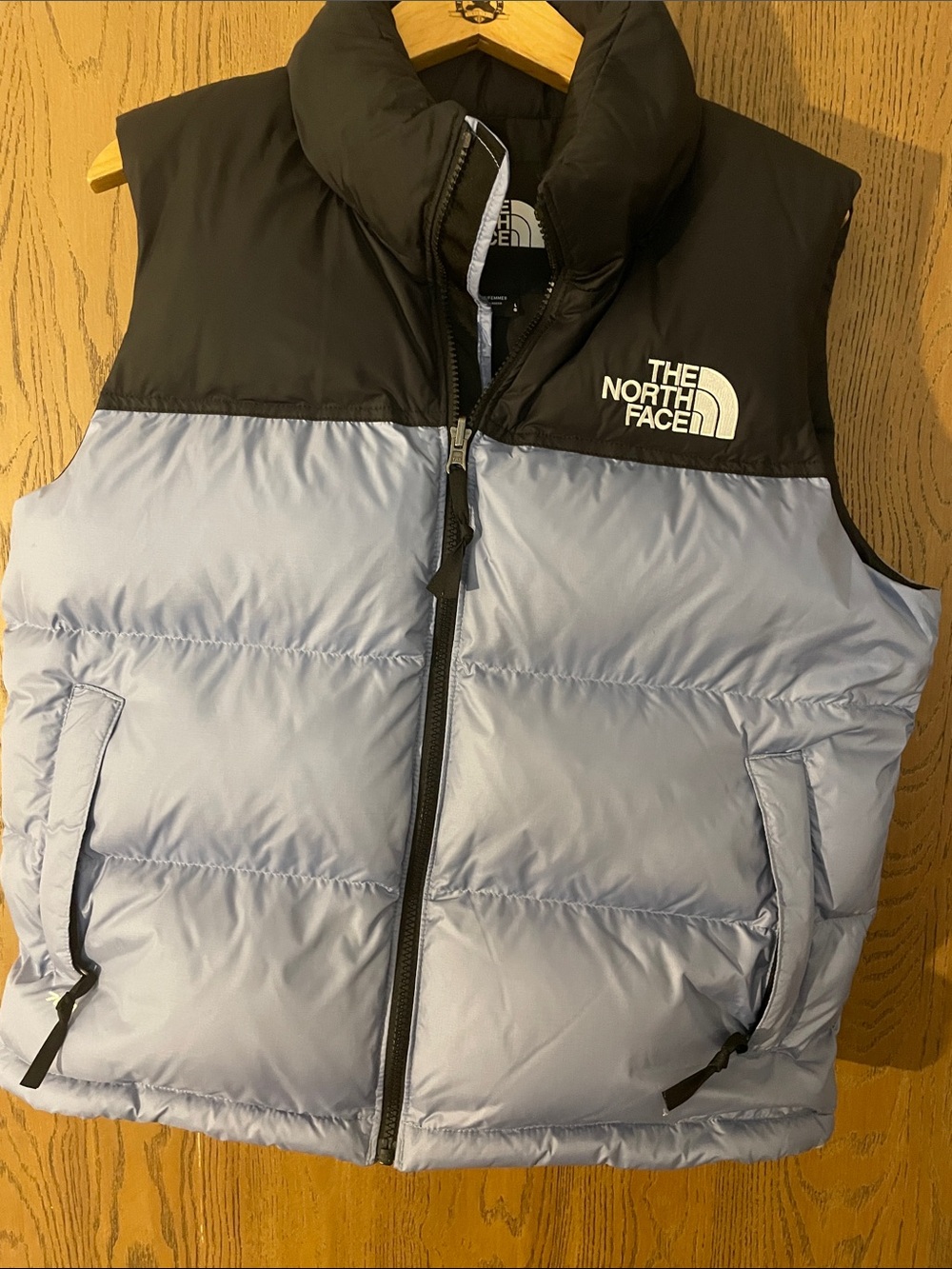 The North Face puffer vest in light blue and black pop